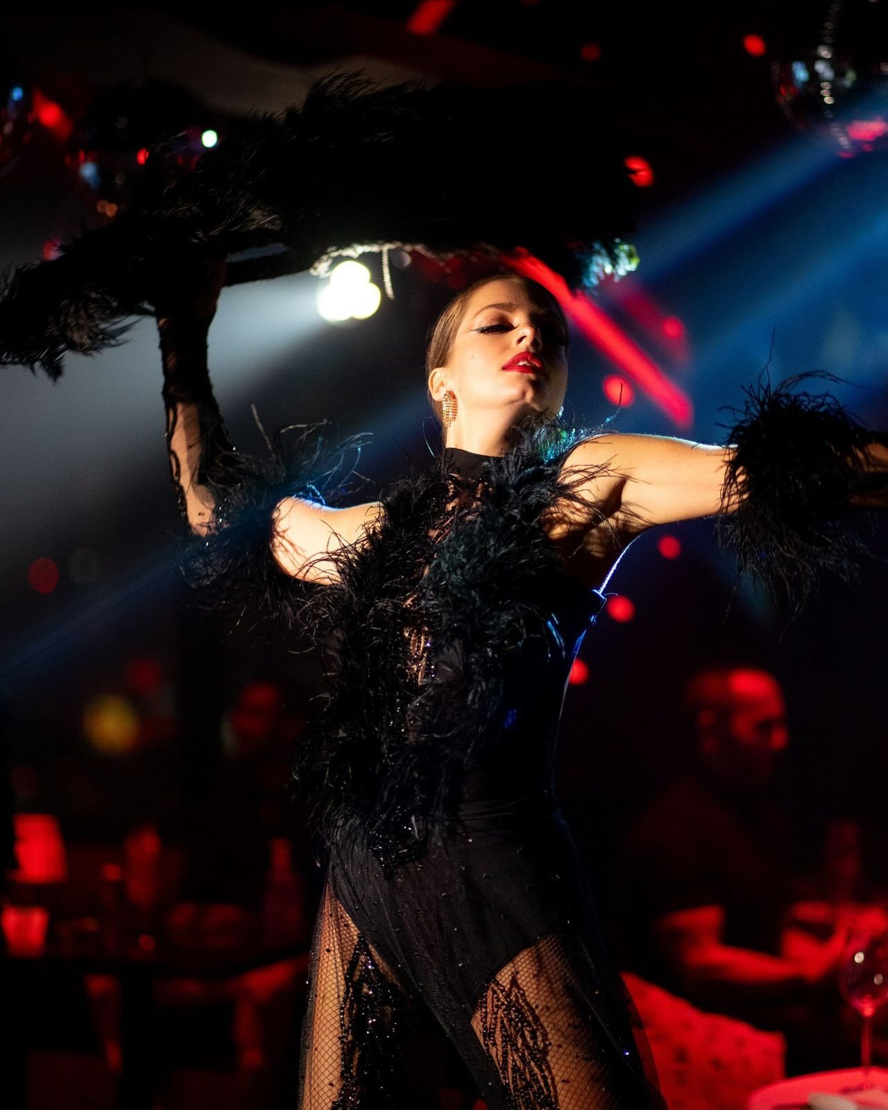 Black feather performance costume on stage